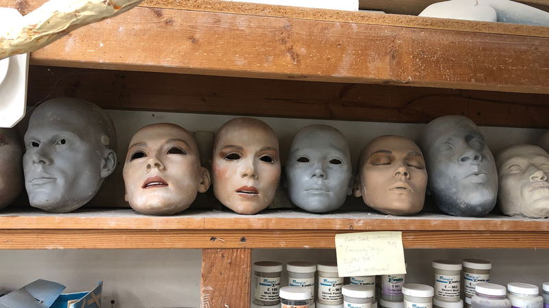 Molds in Tanya Wolf Ragir’s studio of various mannequin masks. One on the right is a mask of Meshach Taylor, made for the Mannequin sequel. The one on the far left is Bill Paxton.